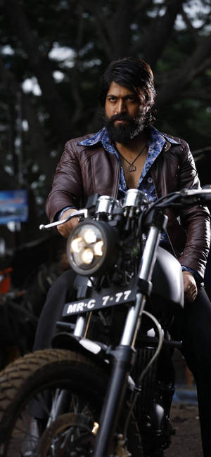 Kgf Rocky On His Motorcycle Wallpaper
