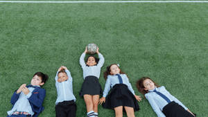 Kids On Grass With Football Hd Wallpaper