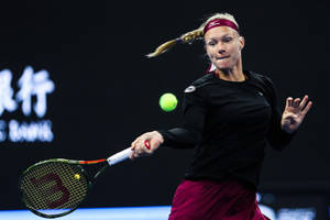 Kiki Bertens Executing A Powerful Forehand Stroke Wallpaper