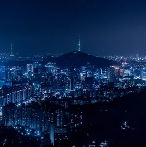 Korean Nighttime Skyline - A Symphony Of Lights Wallpaper