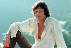 Kris Kristofferson Relaxed Pose Outdoors Wallpaper