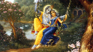 Krishna Bhagwan And Radha On Flower Swing Wallpaper