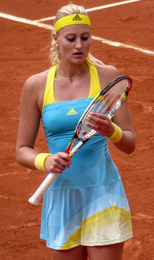 Kristina Mladenovic Caressing Her Racket Wallpaper