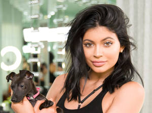 Kylie Jenner Holding Her Dog Wallpaper