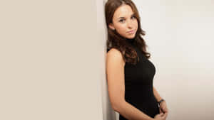 Lacey Chabert Striking A Pose In An Elegant Outfit Wallpaper