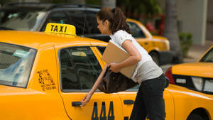 Lady Entering A Taxi Wallpaper