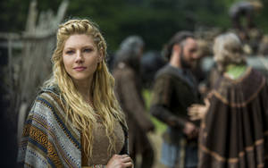 Lagertha With Other Vikings Behind Wallpaper