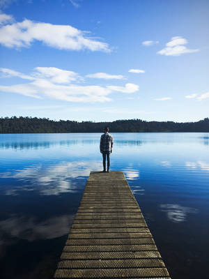 Lake With A Man Standing Wallpaper