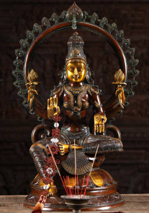 Lakshmi Devi Brass Figurine With Incense Wallpaper