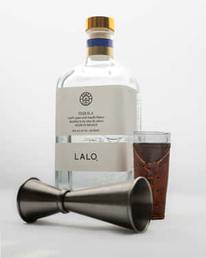 Lalo Tequila Bottleand Cocktail Glass Wallpaper