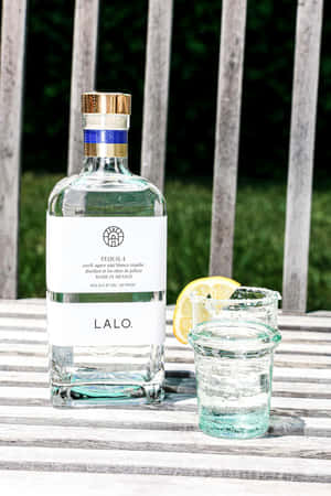 Lalo Tequila Bottleand Glass Outdoor Setting Wallpaper