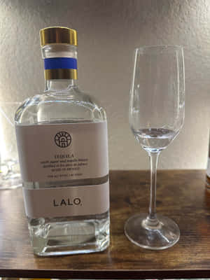 Lalo Tequila Bottleand Glass Wallpaper