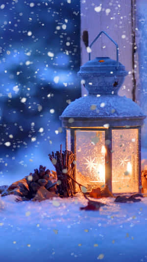 Lantern Lit With Snow Falling Wallpaper