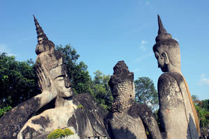 Laos Leaning Statues At Park Wallpaper