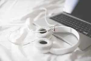 Laptop With Headphones Wallpaper