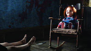 Laughing Chucky On Rocking Chair Wallpaper