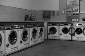 Laundromat Rowof Washing Machines Wallpaper