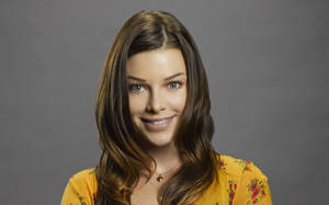 Lauren German With A Yellow Shirt Wallpaper