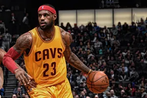 Lebron James Being Cool Dribbling A Basketball Wallpaper