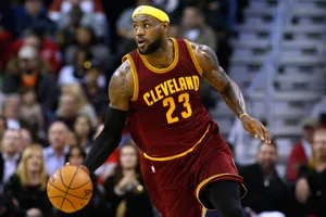 Lebron James Is Cool Holding A Ball Wallpaper