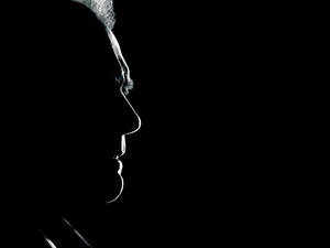 Legendary Clint Eastwood Shadowed Profile Wallpaper