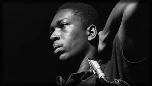 Legendary Jazz Saxophonist John Coltrane In Performance Wallpaper