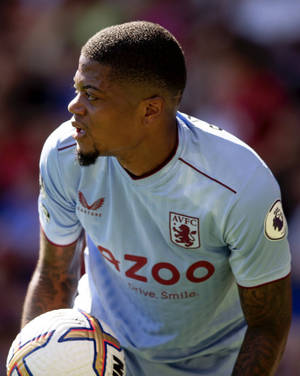 Leon Bailey Holding A Ball Wallpaper