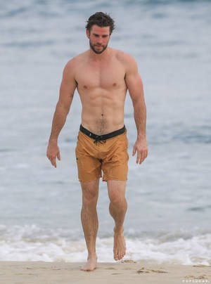 Liam Hemsworth In The Beach Wallpaper