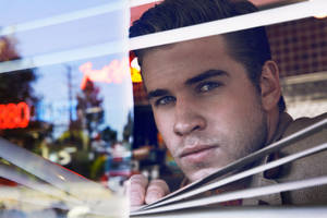 Liam Hemsworth Peeking On The Window Wallpaper