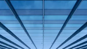 Light Blue Plain Glass Skyscraper Exterior Wallpaper