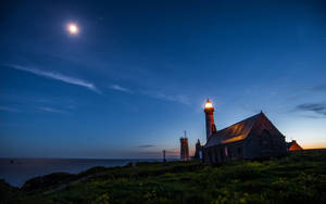 Light House In Moonlight Oceanside Wallpaper