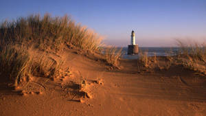 Lighthouse Between Dunes Wallpaper