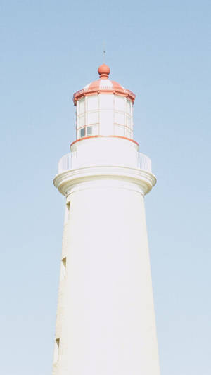Lighthouse On A Baby Blue Sky Wallpaper