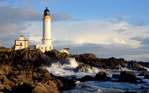 Lighthouse On Seaside Cliff Wallpaper