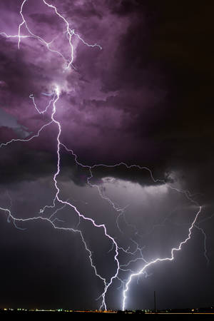 Lightning Strike In Purple And Black Wallpaper