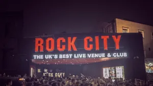 Lil Pump Poses In A Multi Coloured Outfit Wallpaper