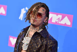 Lil Pump Sporting His Iconic Pink Mohawk Hairstyle Wallpaper