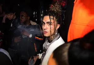 Lil Pump Standing Tall In Front Of A Crowd Wallpaper