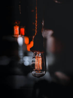Lit Light Bulb Focus Wallpaper