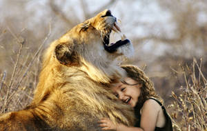 Little Girl Hugging A Wild Animal Wallpaper
