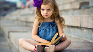 Little Girl Reading Book Wallpaper