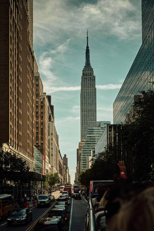 Lively City With The Empire State Building Wallpaper