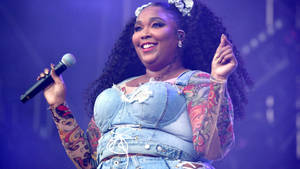 Lizzo With Tattooed Body Suit Wallpaper