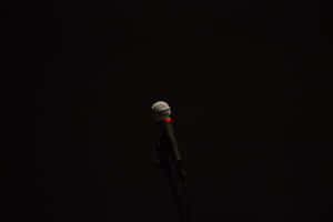 Lone Microphone In The Dark Wallpaper