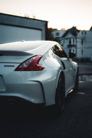 Look At The Sleek And Stylish Design Of The Nissan 370z Wallpaper