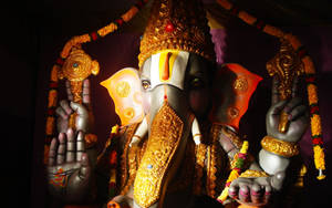 Lord Ganesha With Golden Accessories Wallpaper