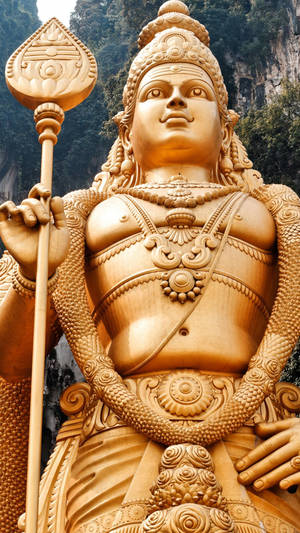 Lord Murugan 4k Golden Statue Portrait Front View Wallpaper