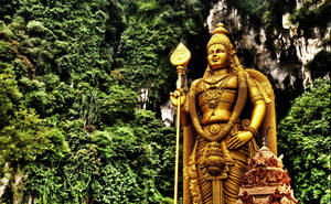 Lord Murugan 4k Statue With Trees Wallpaper