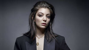 Lorde In Black Suit Wallpaper