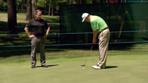 Loren Roberts Giving Putting Stroke Advice Wallpaper